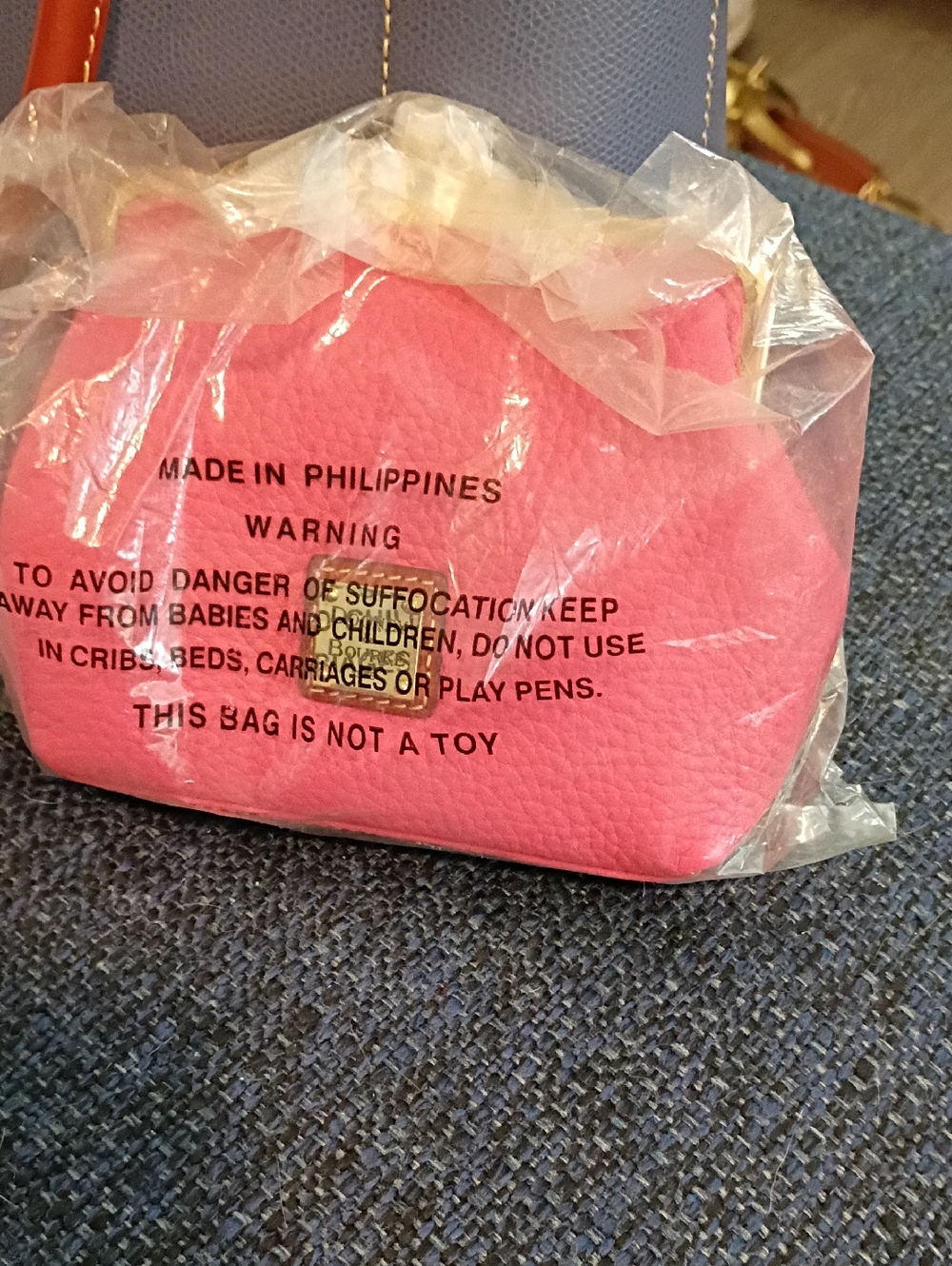 Dooney and Bourke Pink Mini Kisslock Clutch- Stylish Everyday Bag